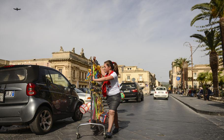 A street vendor wheels her wares into position along the Corso Vittorio Emanuele, Noto's main street.