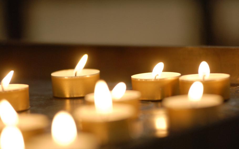 Lighted candles lend a peaceful ambience to the cathedral in Speyer, Germany.