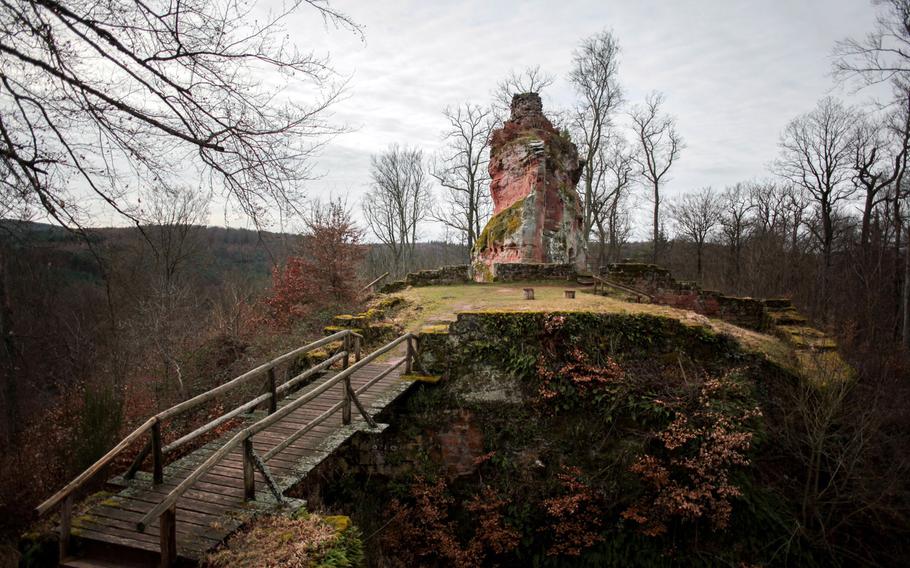 A wooden bridge connects the two main parts of the ruins of Burg Beilstein near Kaiserslautern, Germany. Local lore holds that a beautiful but reclusive maiden lived in the castle. A squire hoping to kidnap her is said to have broken in, only to find her with two ghosts. In the end, the ghosts caused his demise.