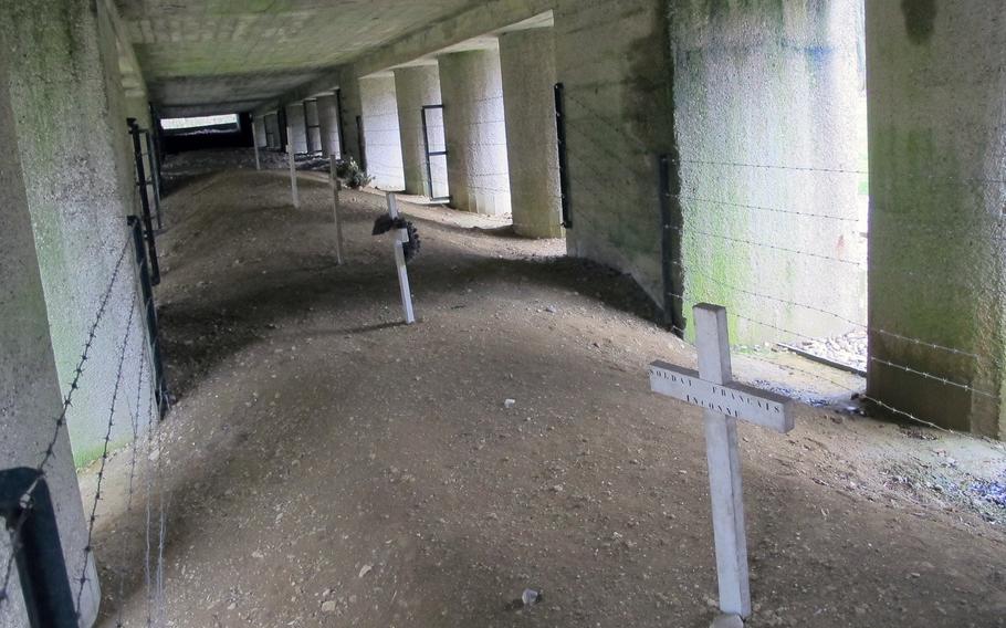 The Trench of Bayonets, where a company of French soldiers was buried alive by German artillery bombardment. Only the bayonets mounted on their rifles were found sticking above the ground. A monument has been built over the site, which is a war grave.