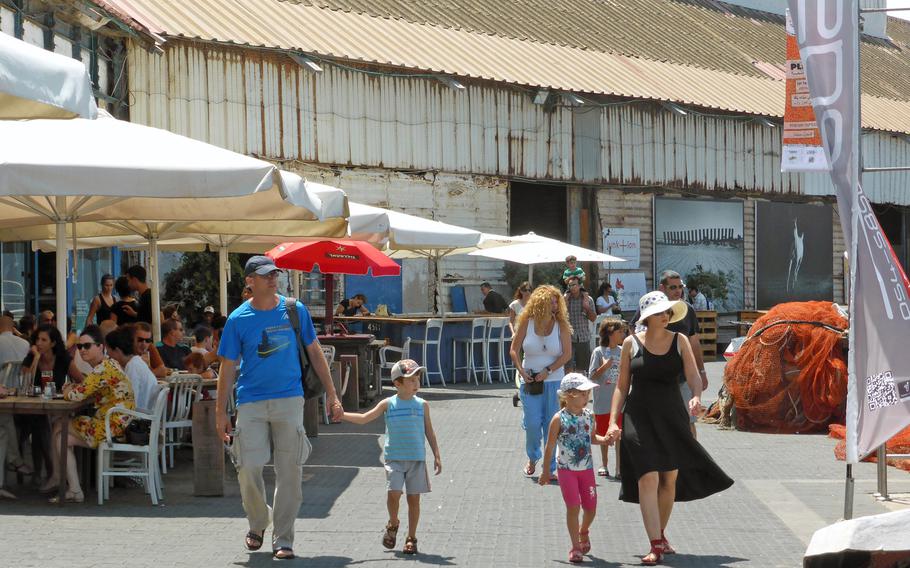 With its restaurants and shops the bustling port  in Jaffa, Israel, attracts tourists and local residents.