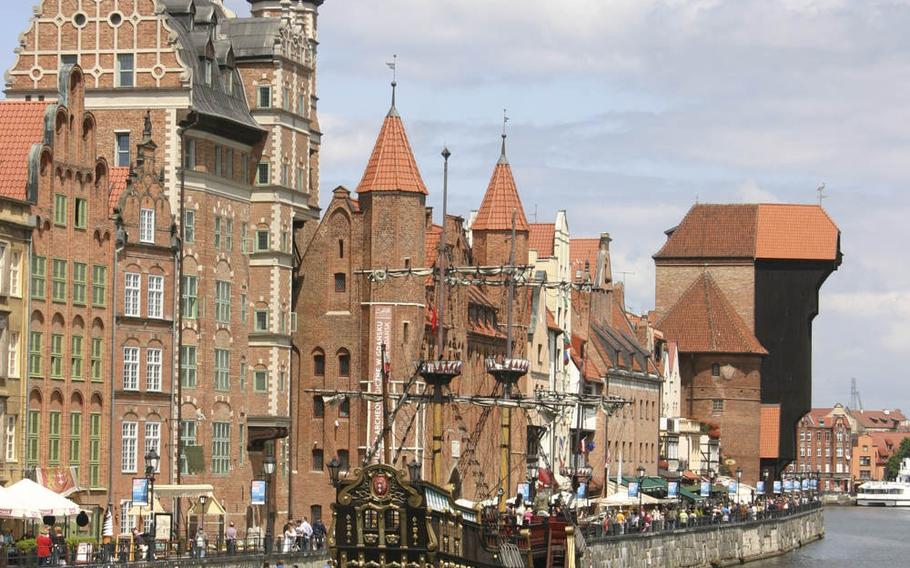 The picturesque waterfront of Gdansk, Poland, is a magnet not only for tourists but for local residents, with its cozy cafes and colorful architecture.
