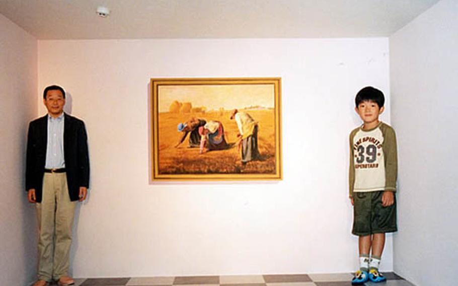 A room at the Takao Trick Art Museum, located at the foot of Mt. Takao west of Tokyo, uses distortions to create an illusion of relative sizes. The father in the picture looks smaller than his son. But it's all an optical illusion.