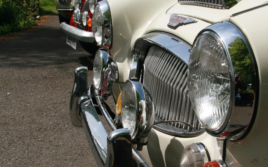 Lights dominate the classic front-end of an Austin Healey at Caledonian Classic Car Hire in Scotland.