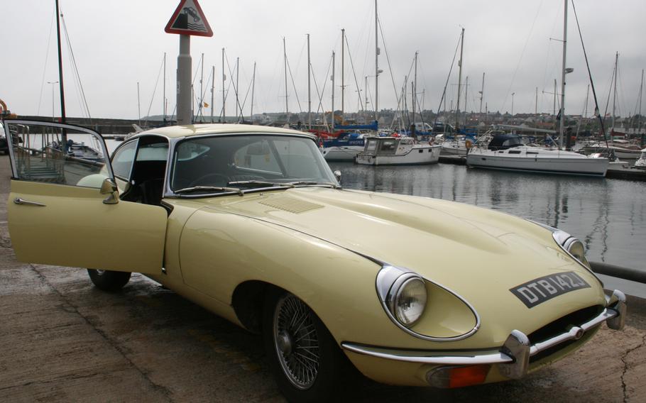 Driving a classic car, such as this  4.2 E-Type Jaguar, in Scotland's charming villages, can be a challenge, since many of the cars don't have power steering and need a lot of room to turn around. Here, our classic-car rental sits at the harbor in the fishing village of Anstruther.