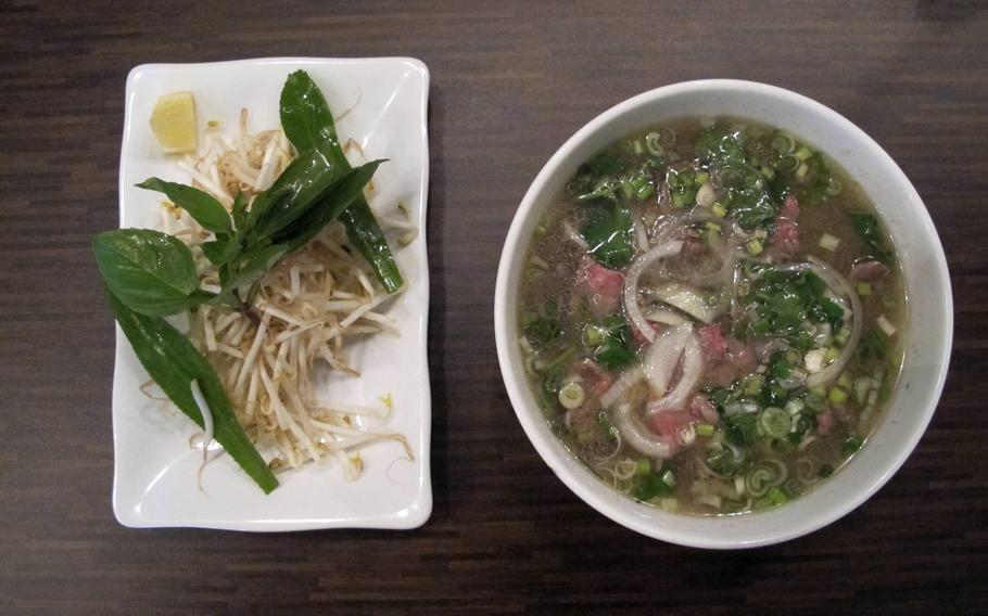 Pho, a favorite Vietnamese street food made of beef, noodles and vegetables, is served with sprouts, coriander and fresh mint at Kaiserslautern's Restaurant Saigon.
