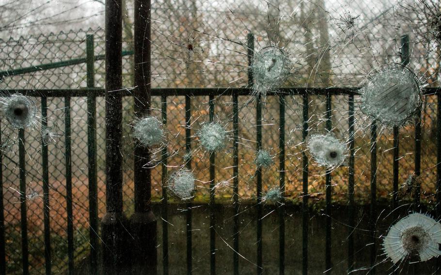 Bullet holes pockmark the glass of a guard shack at the U.S. military's Langerkopf radio relay station.