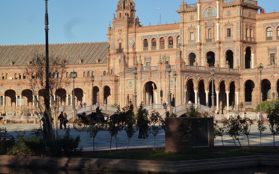 Horse-and-carriage rides are a popular option to enjoy the beautiful setting, but strolling along the Plaza Espana in Seville is equally fine.