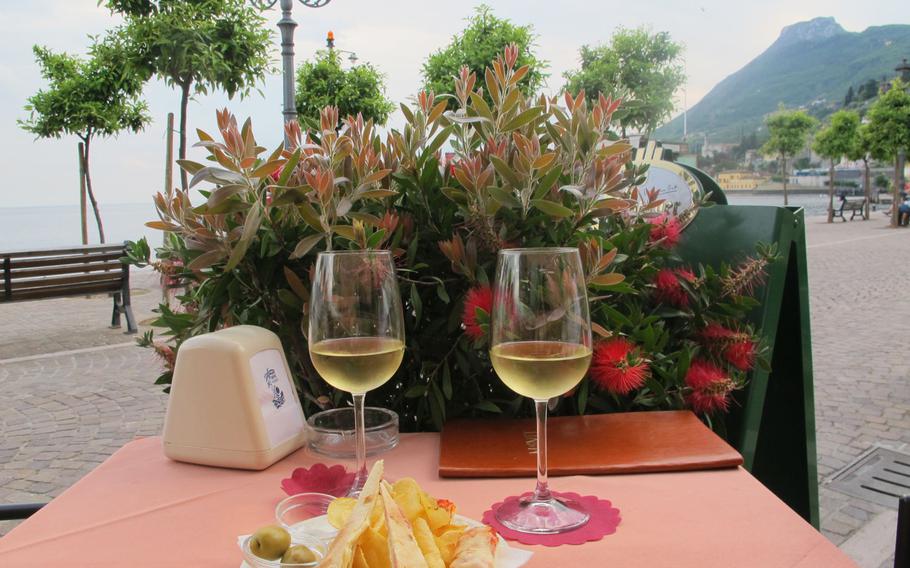 The Grand Hotel a Villa Feltrinelli is in Gargnano, which, like other towns that dot Lake Garda, Italy, offers access to beautiful vistas and good wine and food at affordable prices. The wine: 3 euros. The chips and olives: free. The view of the lake: priceless.
