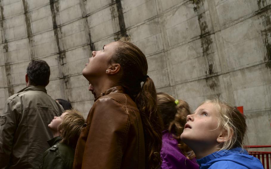 Visitors to Kernie's Family Park at Kalkar, Germany, look up to the 190-foot-high vertical swing inside the cooling tower.