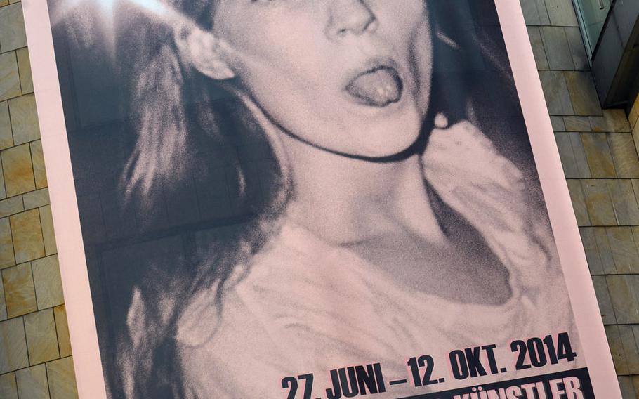 A photo of model Kate Moss sticking her tongue out at the paparazzi is featured on the poster announcing the Schirn's new exhibit.