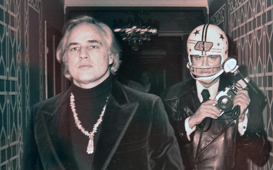 This iconic/ironic photo by Paul Schmulbach of actor Marlon Brando being followed by paparazzo Ron Galella in 1974 is on display at "Paparazzi Photographers, Stars and Artists." Brando was known for his dislike of paparazzi, and Galella, who is also know for his photos of Jacqueline Kennedy Onassis, was perhaps the most infamous paparazzo of his time.
