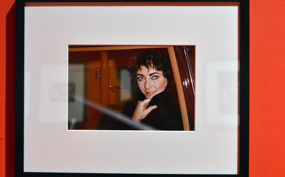 A coy Elizabeth Taylor looks out of the window of a car in this photo taken by Daniel Angeli in Gestaad, Switzerland, in 1979. The photo is one of many of Taylor and other stars on display at the Schirn's new exhibit "Paparazzi Photographers, Stars and Artists."