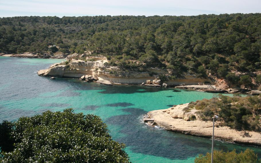 Views from the coastal cycling trail over Mallorca's picturesque nudist beach at El Mago.