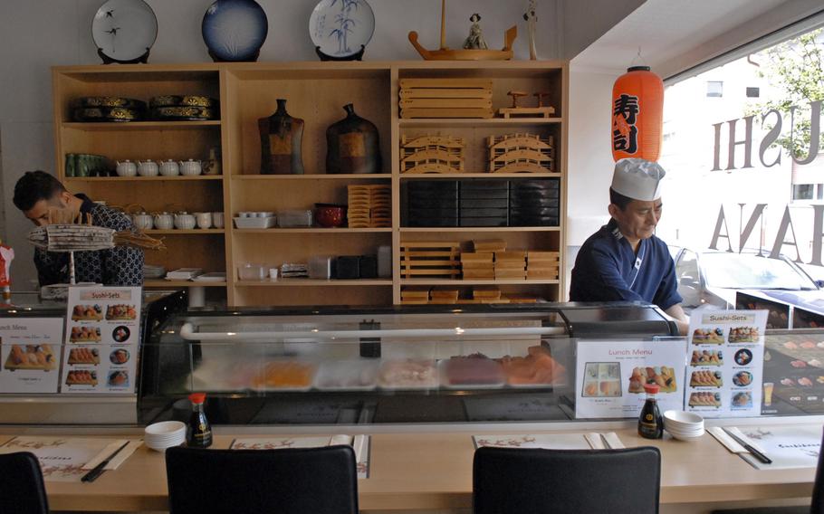 Customers at Sushi Hana can watch chef Jong Pil-Park, right, prepare Japanese-style sushi behind the restaurant's counter. Located in Ramstein-Miesenbach, Germany, Sushi Hana is open for lunch and dinner six days a week.