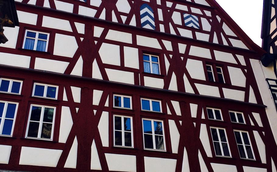 Many of Rothenburg, Germany's beautiful structures, such as this one, are half-timbered buildings. This pretty-as-a-picture Bavarian town draws tourists from around the world.