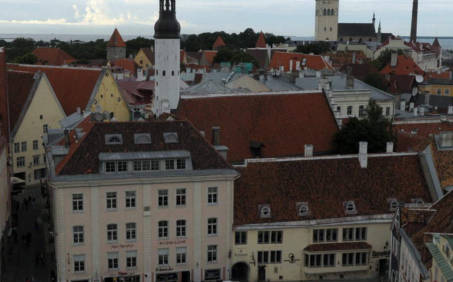 A view from the bell tower of the town hall in Tallinn, Estonia. The medieval spire of St. Olaf's Church, is visible in the distance at right.