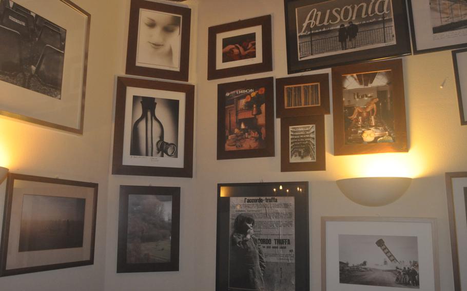 An eclectic collection of artwork decorates a corner of Osteria da Afro in Spilimbergo, Italy. The main dining area can hold about 30 people.