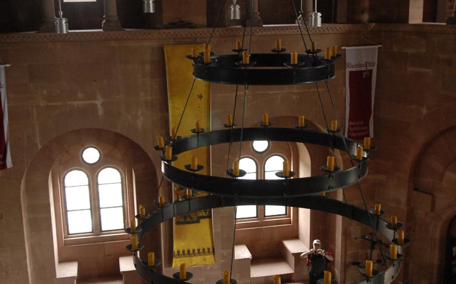 The central room inside Burg Trifels is outfitted with a marble floor and an impressive, three-tiered chandelier.