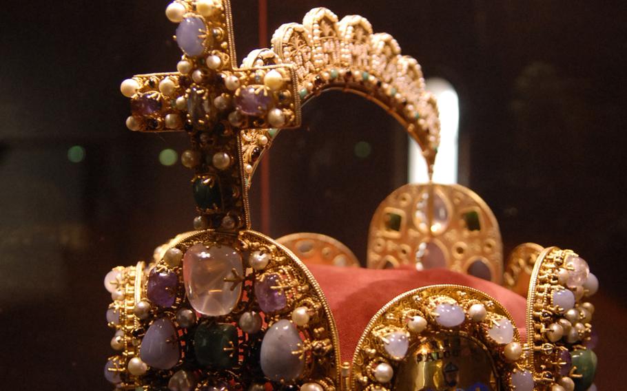 A replica of a jewel-encrusted imperial crown is safeguarded behind a glass case inside Burg Trifels, a medieval-era castle about an hour south of Kaiserslautern.