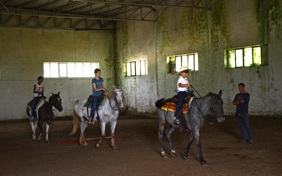 Childern take riding lessons from Ivan Ceolin in an indoor ring at Agriturismo al Ranch.
Jason Duhr/Stars and Stripes