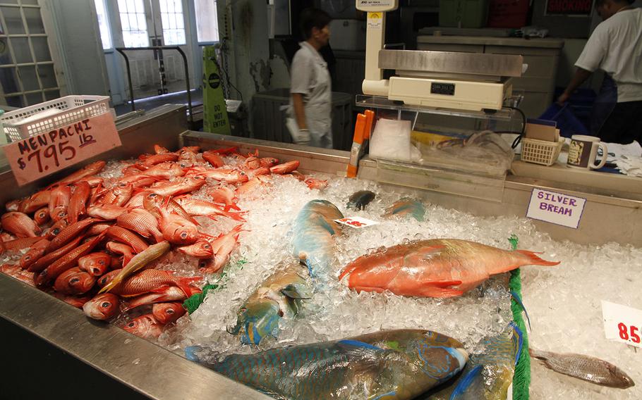 A wide selection of whole, fresh fish is available at Honolulu's Chinatown, such as at this shop, which cleans them and even throws in a bag of ice for the trip home.