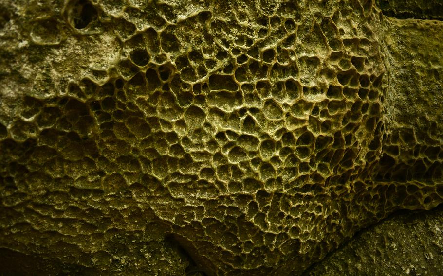 Pocked sandstone creates an other-worldly image along the Walking Tour Mullerthal-Consdorf hiking trail in Luxembourg