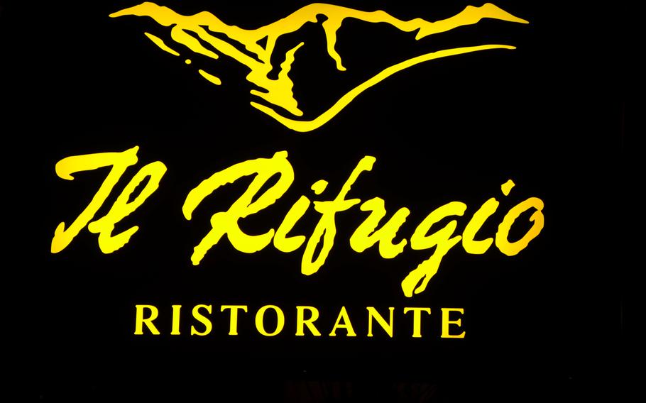 A sign for Il Rifugio, a restaurant located in the foothills below Piancavallo, Italy.