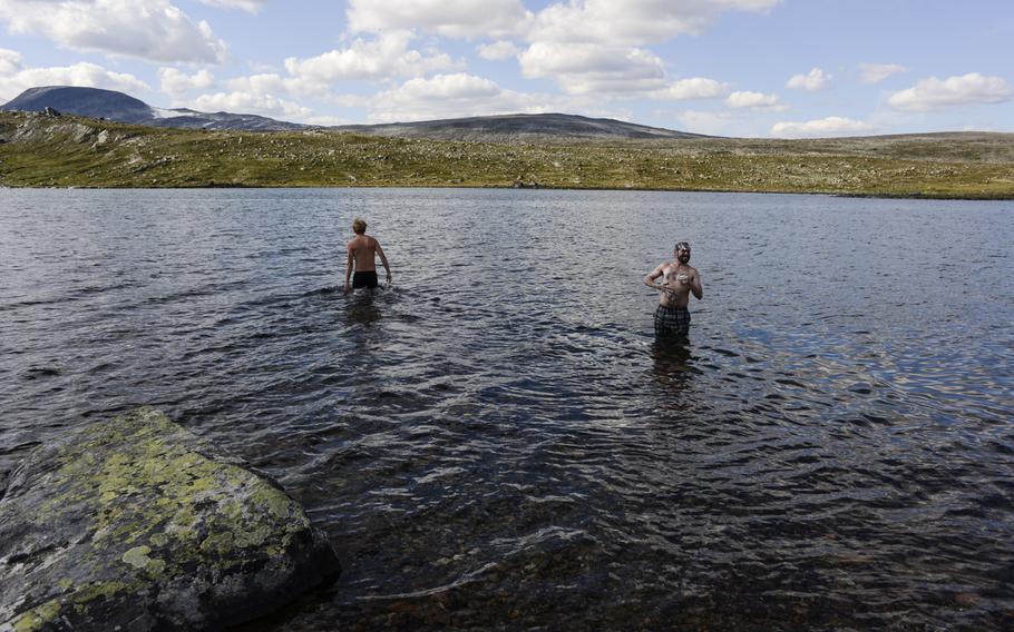 Stars and Stripes reporter Heath Druzin bathes in the chilly water of Lake Amotsvatnet near the Amotsdalshytta hut in Dovrefjell National Park.