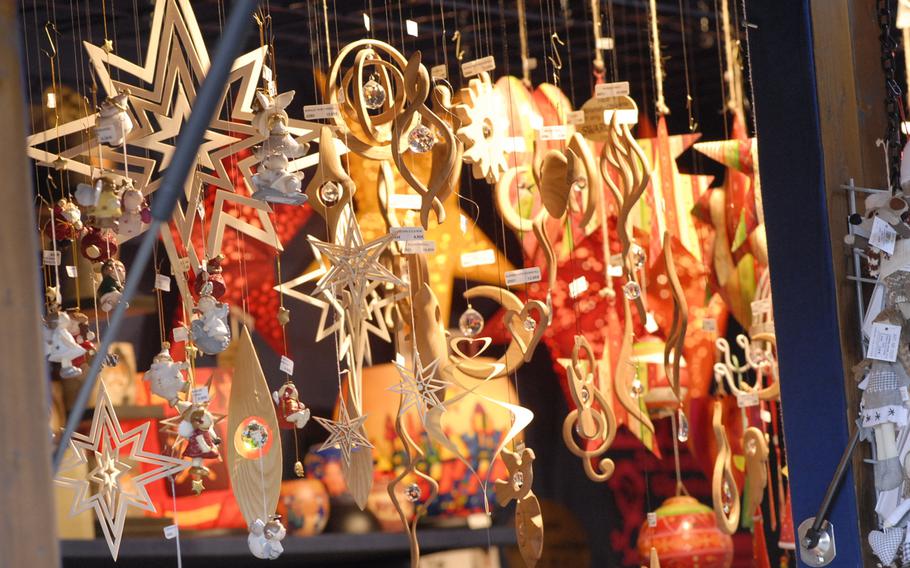 Hand-carved wooden Christmas ornaments hang from a stall in December 2013 at the annual Christmas market in Speyer, Germany.