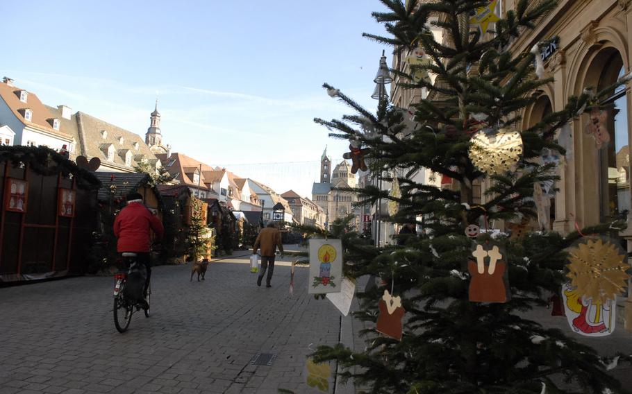 A Christmas tree adorned with handmade decorations adds to the festive spirit of the Speyer Christmas Market in December 2013. Stalls are set up along the city's old section, between the Speyer Dom (cathedral) and the Old Mint building.