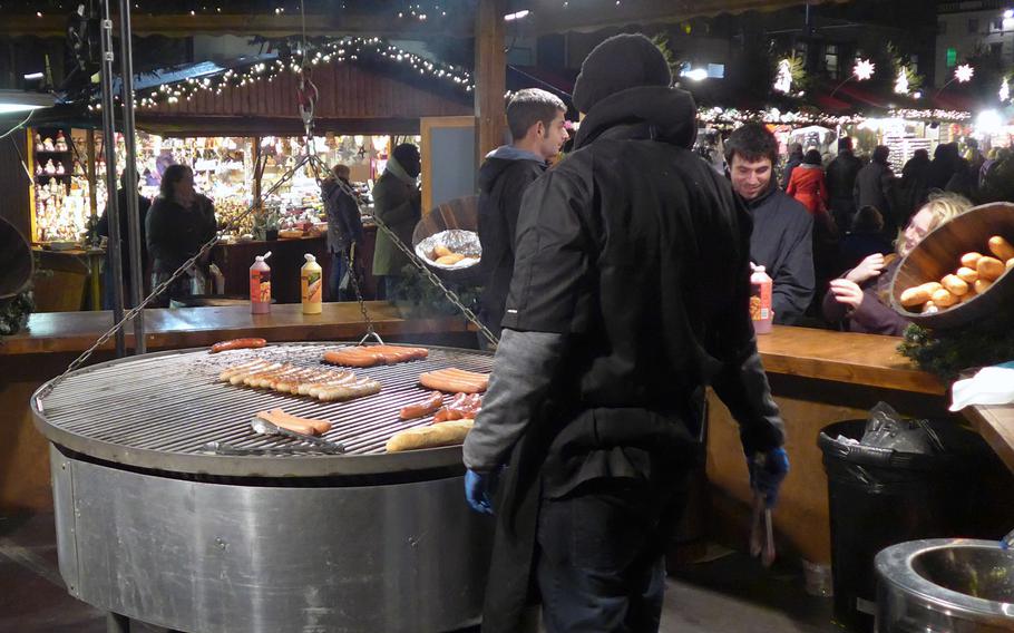 Polish and German-style brats cook on a grill at the European Christmas Market in Edinburgh, Scotland, in December 2013. The market is much like the ones you will find throughout Germany. 