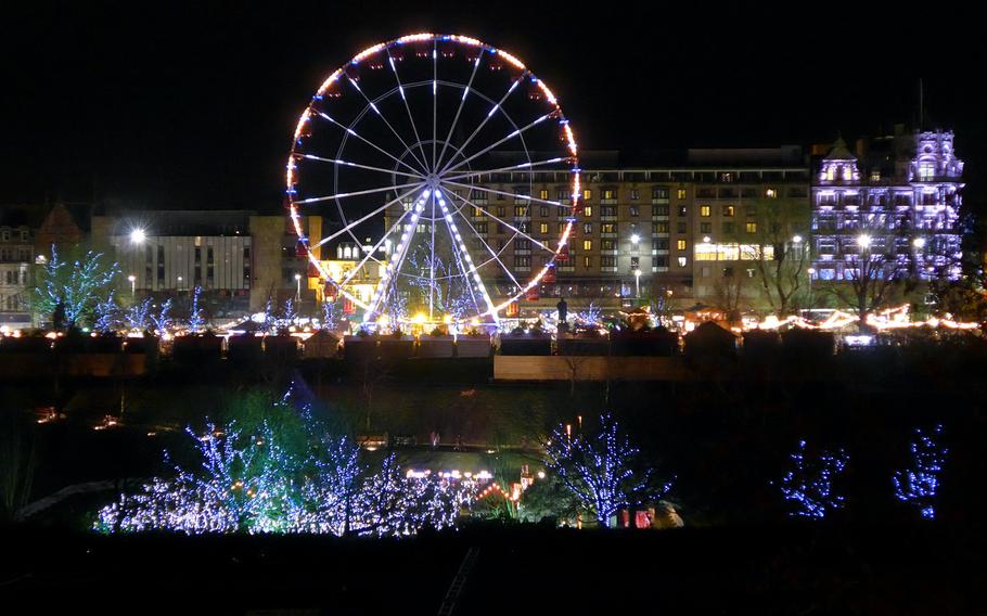 The European Christmas Market in Edinburgh, Scotland, with its Ferris wheel as seen from across East Princes Street Gardens, December 2013.