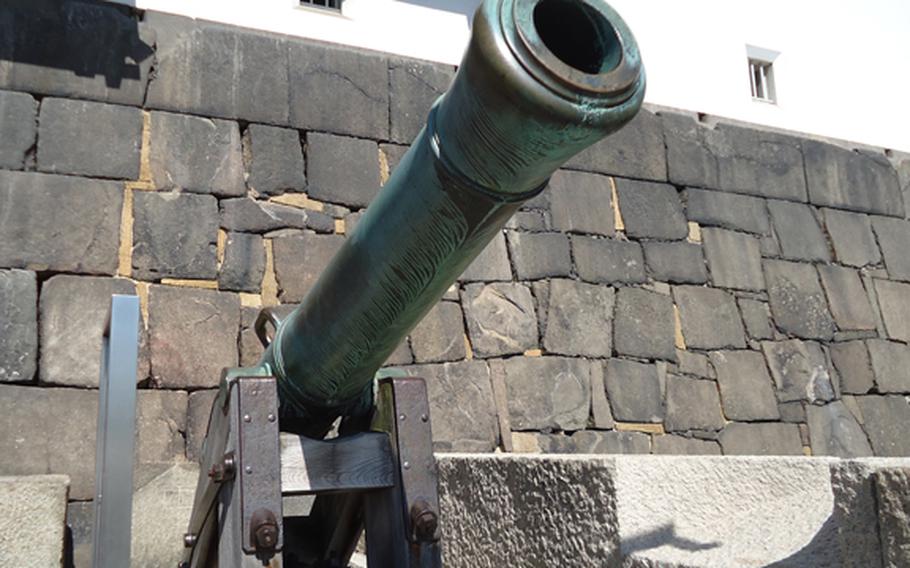 A cannon greets visitors at the entrance to Osaka Castle. While the castle is one of more than 100 in the island nation, it stands in a class almost by itself in historical significance.