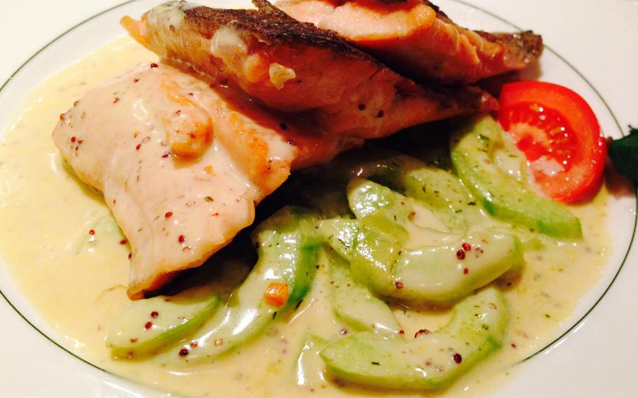 Grilled salmon served with braised cucumbers in a creamy dill sauce. The cucumbers weren't  mushy by any means, and worked perfectly with the salmon and dill hollandaise sauce.