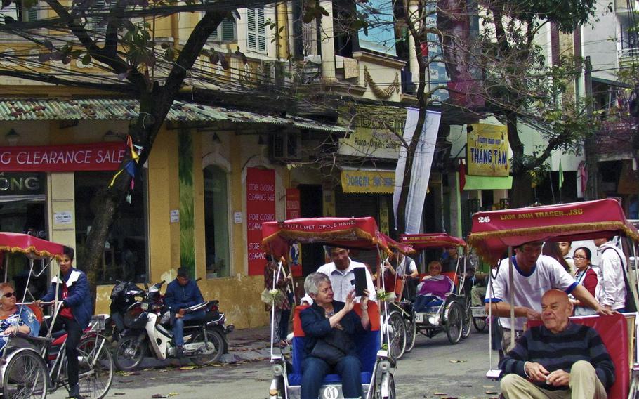 Three-wheel pedicabs known as cyclos give tourists a way to take in Hanoi's attractions. It's also a bit of an adrenalin rush as the busy traffic weaves around the slow-moving vehicles.