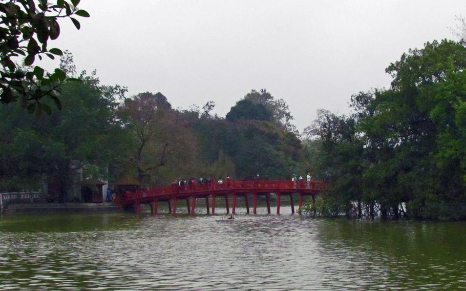 The Huc Bridge connects the shore of Hanoi's Hoan Kiem to Jade Island. The Temple of the Jade Mountain, which dates to the 18th century, sits on the island.