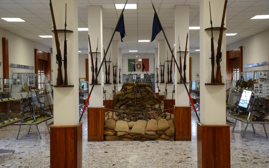 A machine-gun bunker is the center piece of a room in the museum at the Military Sacrarium Redipuglia. Other World War I items on display include weapons, uniforms, and awards and citations soldiers received.