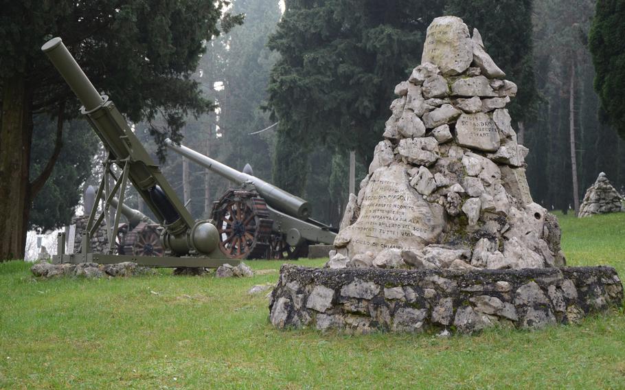 Tombstones and military equipment line paths throughout Remembrance Park at the Military Sacrarium Redipuglia, located near Redipuglia, Italy, and an hour's drive from Aviano Air Base.