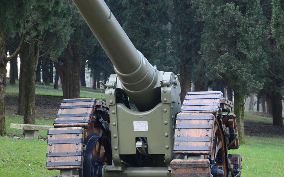 Military weaponry and equipment line paths throughout Remembrance Park at the Military Sacrarium Redipuglia in Italy.