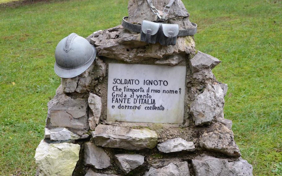 Military items decorate the tomb of an unknown soldier at the Military Sacrarium Redipuglia's Remembrance Park.
