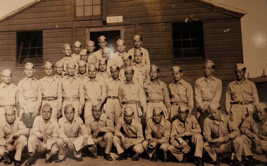 Students of the language school pose in front of a building at Camp Savage in Minnesota in 1944 in this photo from the exhibit "America's Secret Weapon: Japanese Americans in the Military Intelligence Service in World War II." 