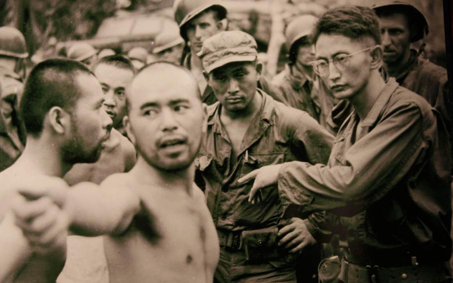 Japanese prisoners answer questions from MIS Nisei interrogators Harry Fukuhara, right, and Shoji Ishii, in this 1944 photo on display at the U.S. Army Museum of Hawaii’s exhibit on the role of Japanese-Americans during World War II.
