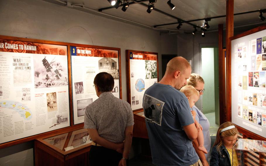 
Visitors to the U.S. Army Museum of Hawaii view the exhibit on the role of Japanese Americans working in the intelligence field during World War II.