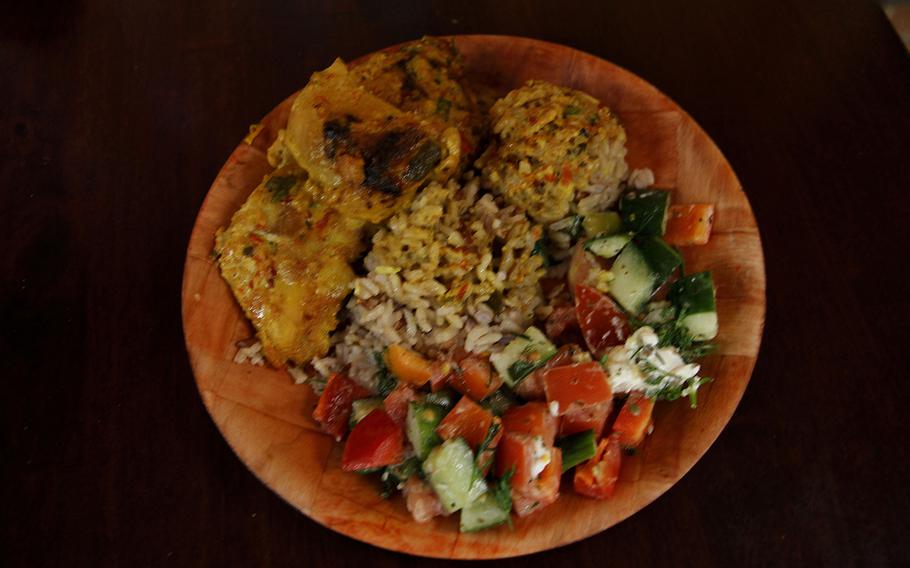 The $8 "regular" plate at Da Spot includes choice of entree,salad and rice. For an extra $2.50, you can substitute the salad for a wide variety of other cold dishes, such as this cuccumber-tomato tabouli-flavored dish accompaning lemon-coconut chicken and brown rice.
