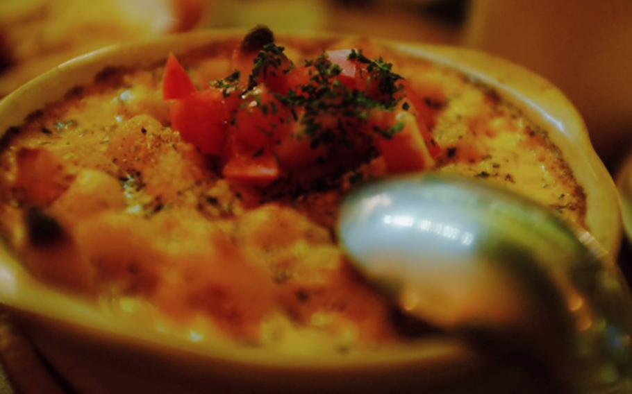 The macaroni and cheese at Hato's Bar in Tokyo is served fresh out of the oven bubbling hot and tastes every bit as good as it looks.