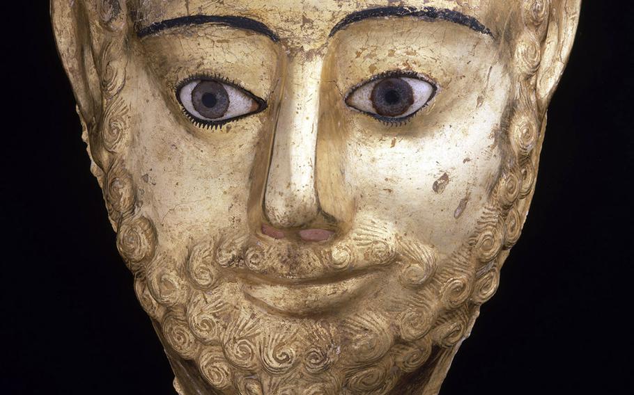 An ancient  Egyptian mask that looks quite Greek is among the works at Vicenza's municipal museum in the Basilica Palladiana.  