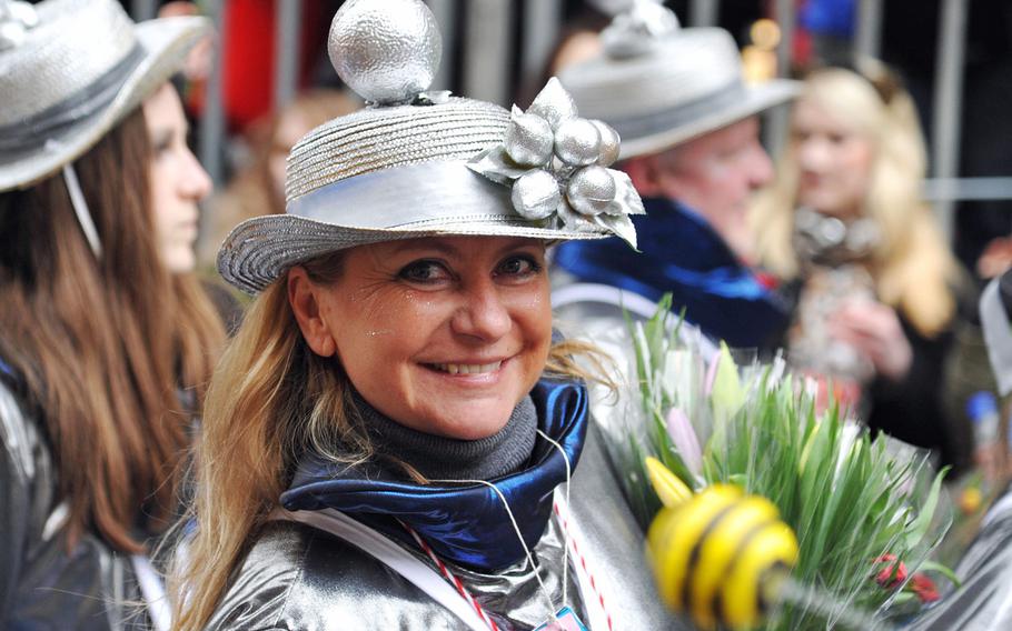 A participant marches down the parade route at the 2014 Cologne Rose Monday parade.  