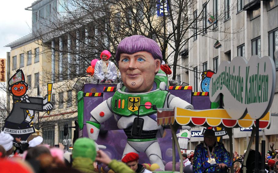 German Chancellor Angela Merkel was the centerpiece of this float at the 2014 Cologne Rose Monday Carnival parade. Many of the parade's floats have political themes, satirically skewering politics and politicians.