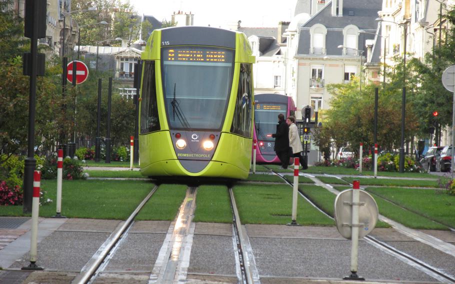 In Reims, the bright, cheerful light rail cars feature a champagne glass motif in their design.